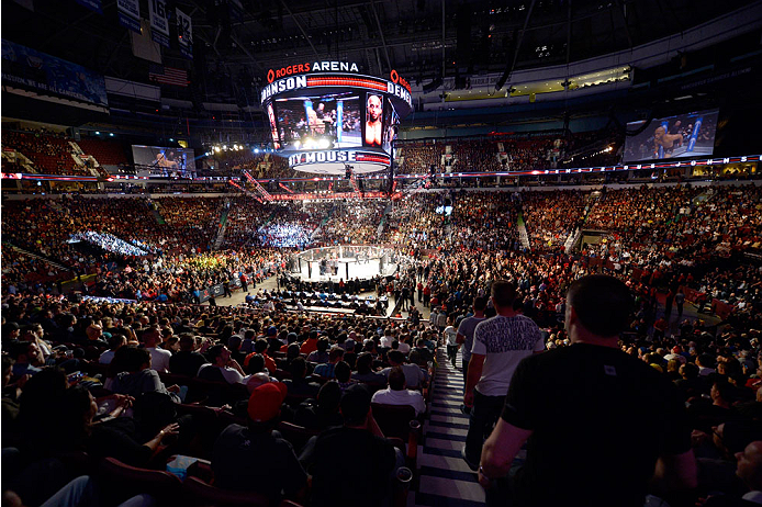 VANCOUVER, BC - JUNE 14: A general view of Demetrious 'Mighty Mouse' Johnson entering the Octagon before his championship bout against Ali Bagautinov during the UFC 174 event at Rogers Arena on June 14, 2014 in Vancouver, British Columbia, Canada. (Photo