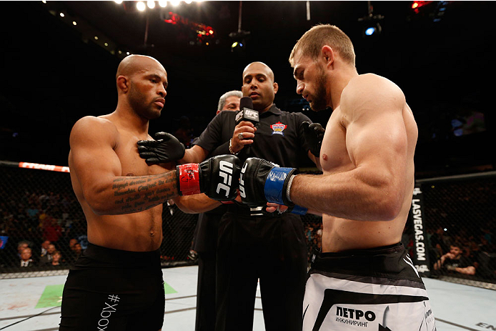 VANCOUVER, BC - JUNE 14: (L-R) UFC Flyweight Champion Demetrious 'Mighty Mouse' Johnson and challenger Ali Bagautinov touch gloves before their UFC flyweight championship bout at Rogers Arena on June 14, 2014 in Vancouver, Canada. (Photo by Josh Hedges/