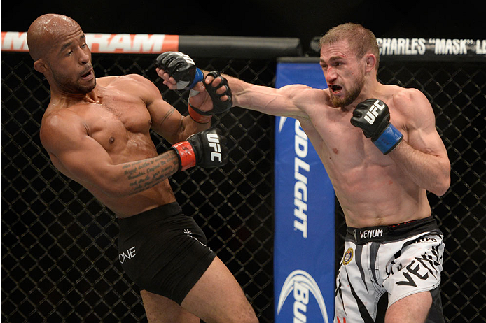 VANCOUVER, BC - JUNE 14: (L-R) UFC Flyweight Champion Demetrious 'Mighty Mouse' Johnson avoids a punch from Ali Bagautinov during their flyweight championship bout at the UFC 174 event at Rogers Arena on June 14, 2014 in Vancouver, British Columbia, Cana