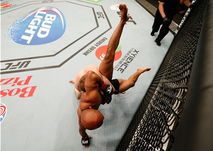 VANCOUVER, BC - JUNE 14: (L-R) Ali Bagautinov takes down Demetrious "Mighty Mouse" Johnson in their UFC flyweight championship bout at Rogers Arena on June 14, 2014 in Vancouver, Canada. (Photo by Josh Hedges/Zuffa LLC/Zuffa LLC via Getty Images)