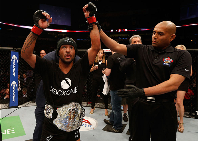 VANCOUVER, BC - JUNE 14: Demetrious "Mighty Mouse" Johnson reacts after his unanimous decision victory over Ali Bagautinov in their UFC flyweight championship bout at Rogers Arena on June 14, 2014 in Vancouver, Canada. (Photo by Josh Hedges/Zuffa LLC/Zu