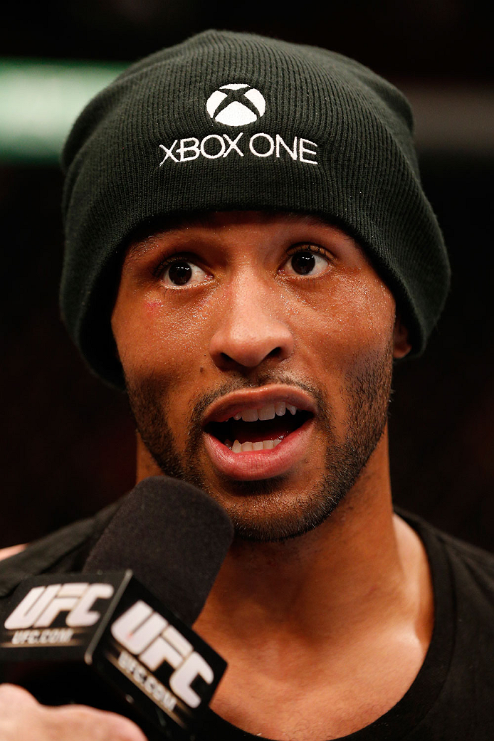 VANCOUVER, BC - JUNE 14: Demetrious "Mighty Mouse" Johnson reacts after his unanimous decision victory over Ali Bagautinov in their UFC flyweight championship bout at Rogers Arena on June 14, 2014 in Vancouver, Canada. (Photo by Josh Hedges/Zuffa LLC/Zu