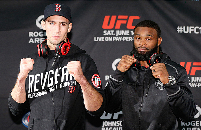 VANCOUVER, CANADA - JUNE 12: (L-R) Opponents Rory MacDonald and Tyron Woodley pose for photos at the EA Sports Capture Lab on June 12, 2014 in Vancouver, British Columbia, Canada. (Photo by Josh Hedges/Zuffa LLC/Zuffa LLC via Getty Images)
