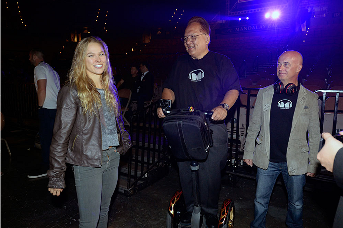 LAS VEGAS, NV - JULY 4: UFC Women's Bantamweight Champion Ronda Rousey (L) interacts with CEO OF Monster Noel Lee (C) during the UFC 175 weigh-in inside the Mandalay Bay Events Center on July 4, 2014 in Las Vegas, Nevada. (Photo by Jeff Bottari/Zuffa LLC