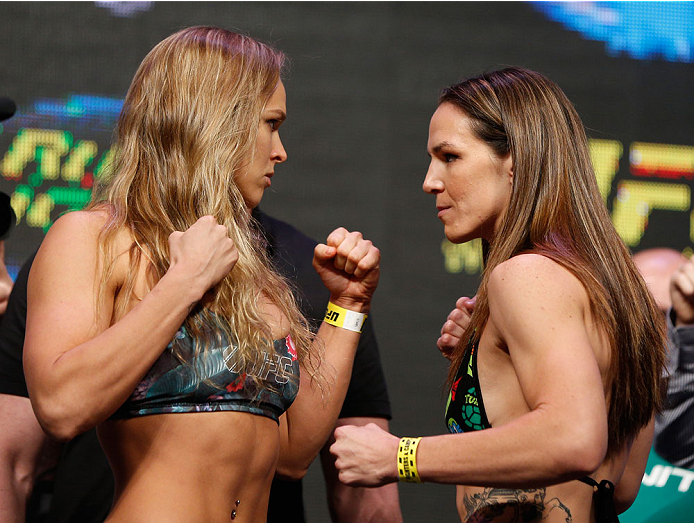 LAS VEGAS, NV - JULY 04: (L-R) UFC Women's Bantamweight Champion Ronda Rousey faces off with Alexis Davis during the UFC 175 weigh-in inside the Mandalay Bay Events Center on July 4, 2014 in Las Vegas, Nevada. (Photo by Josh Hedges/Zuffa LLC/Zuffa LLC v