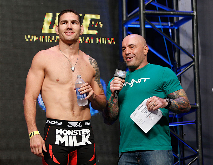 LAS VEGAS, NV - JULY 04: (L-R) UFC Middleweight Champion Chris Weidman talks with Joe Rogan during the UFC 175 weigh-in inside the Mandalay Bay Events Center on July 4, 2014 in Las Vegas, Nevada. (Photo by Josh Hedges/Zuffa LLC/Zuffa LLC via Getty Image