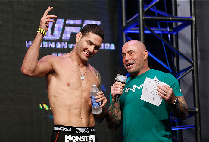 LAS VEGAS, NV - JULY 04: (L-R) UFC Middleweight Champion Chris Weidman talks with Joe Rogan during the UFC 175 weigh-in inside the Mandalay Bay Events Center on July 4, 2014 in Las Vegas, Nevada. (Photo by Josh Hedges/Zuffa LLC/Zuffa LLC via Getty Image