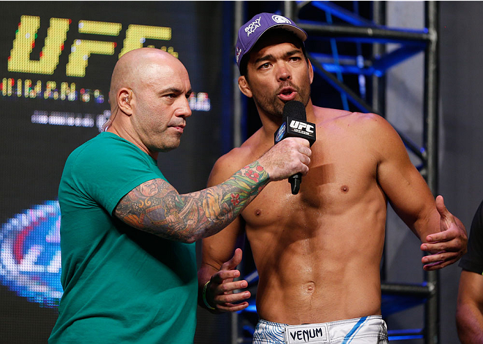 LAS VEGAS, NV - JULY 04: (L-R) Joe Rogan talks with Lyoto Machida during the UFC 175 weigh-in inside the Mandalay Bay Events Center on July 4, 2014 in Las Vegas, Nevada. (Photo by Josh Hedges/Zuffa LLC/Zuffa LLC via Getty Images)