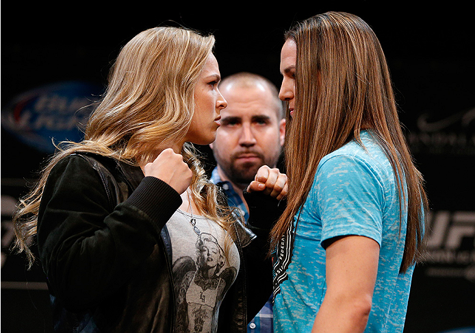 LAS VEGAS, NV - JULY 03: (L-R) Opponents Ronda Rousey and Alexis Davis face off during the UFC Ultimate Media Day at the Mandalay Bay Resort and Casino on July 3, 2014 in Las Vegas, Nevada. (Photo by Josh Hedges/Zuffa LLC/Zuffa LLC via Getty Images)