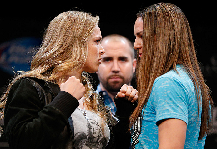 BESTPIX - LAS VEGAS, NV - JULY 03: (L-R) Opponents Ronda Rousey and Alexis Davis face off during the UFC Ultimate Media Day at the Mandalay Bay Resort and Casino on July 3, 2014 in Las Vegas, Nevada. (Photo by Josh Hedges/Zuffa LLC/Zuffa LLC via Getty I