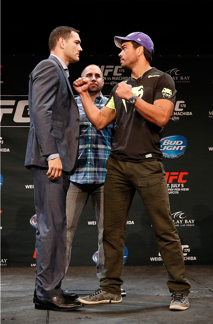 LAS VEGAS, NV - JULY 03: (L-R) Opponents Chris Weidman and Lyoto Machida face off during the UFC Ultimate Media Day at the Mandalay Bay Resort and Casino on July 3, 2014 in Las Vegas, Nevada. (Photo by Josh Hedges/Zuffa LLC/Zuffa LLC via Getty Images)