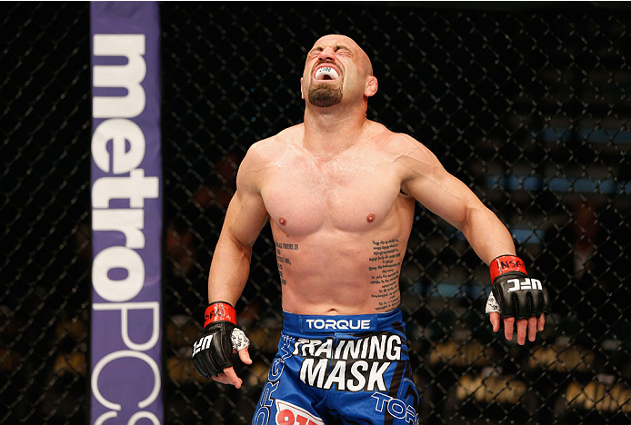 LAS VEGAS, NV - SEPTEMBER 27: Manval Gamburyan reacts after being kicked below the belt by Cody Gibson in their bantamweight fight during the UFC 178 event inside the MGM Grand Garden Arena on September 27, 2014 in Las Vegas, Nevada. (Photo by Josh Hedg