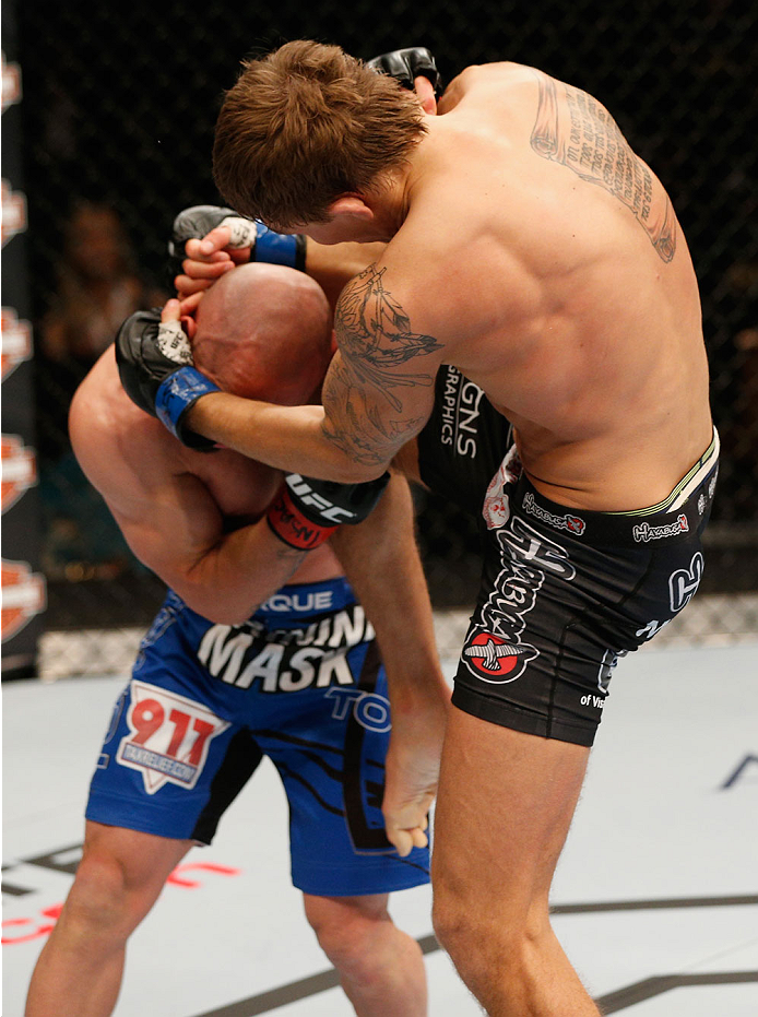 LAS VEGAS, NV - SEPTEMBER 27: Cody Gibson knees Manvel Gamburyan in their bantamweight fight during the UFC 178 event inside the MGM Grand Garden Arena on September 27, 2014 in Las Vegas, Nevada. (Photo by Josh Hedges/Zuffa LLC/Zuffa LLC via Getty Image