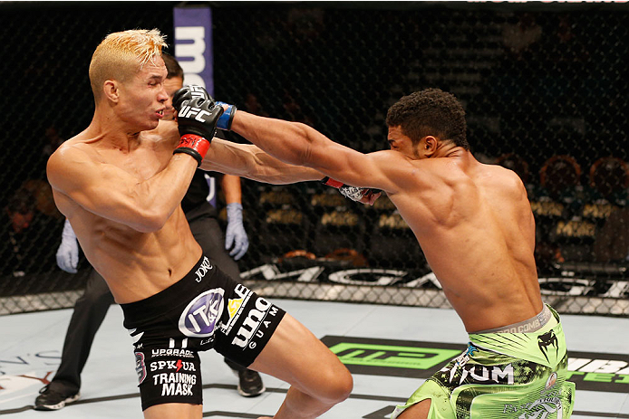 LAS VEGAS, NV - SEPTEMBER 27: (L-R) Jon Tuck and Kevin Lee exchange punches in their lightweight fight during the UFC 178 event inside the MGM Grand Garden Arena on September 27, 2014 in Las Vegas, Nevada. (Photo by Josh Hedges/Zuffa LLC/Zuffa LLC via G