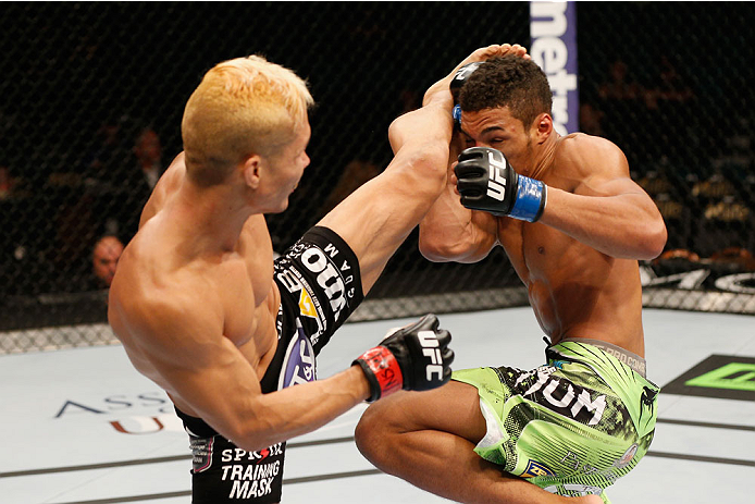 LAS VEGAS, NV - SEPTEMBER 27: (L-R) Jon Tuck kicks Kevin Lee in their lightweight fight during the UFC 178 event inside the MGM Grand Garden Arena on September 27, 2014 in Las Vegas, Nevada. (Photo by Josh Hedges/Zuffa LLC/Zuffa LLC via Getty Images)