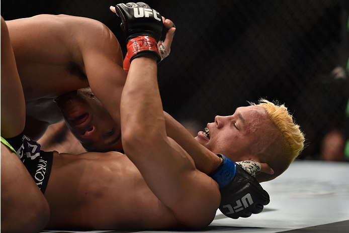 LAS VEGAS, NV - SEPTEMBER 27: Kevin Lee controls the body of Jon Tuck in their lightweight fight during the UFC 178 event inside the MGM Grand Garden Arena on September 27, 2014 in Las Vegas, Nevada. (Photo by Jeff Bottari/Zuffa LLC/Zuffa LLC via Getty