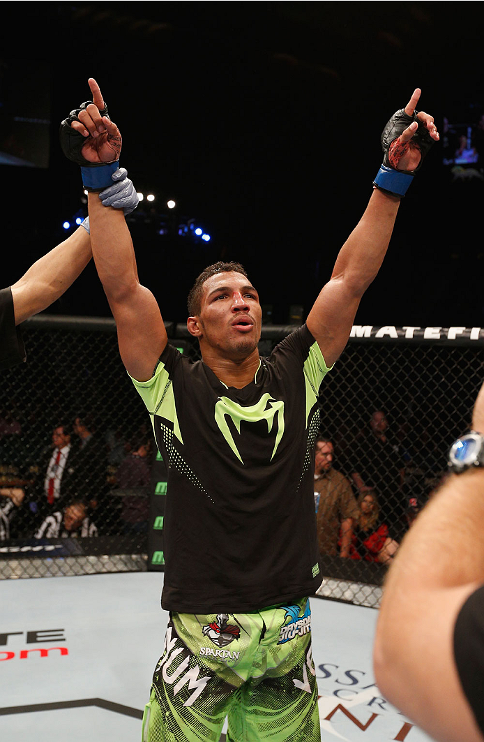 LAS VEGAS, NV - SEPTEMBER 27: Kevin Lee celebrates after defeating Jon Tuck in their lightweight fight during the UFC 178 event inside the MGM Grand Garden Arena on September 27, 2014 in Las Vegas, Nevada. (Photo by Josh Hedges/Zuffa LLC/Zuffa LLC via G