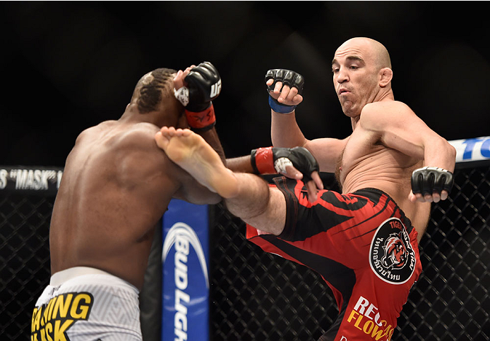 LAS VEGAS, NV - SEPTEMBER 27: (R-L) Brian Ebersole kicks John Howard in their welterweight fight during the UFC 178 event inside the MGM Grand Garden Arena on September 27, 2014 in Las Vegas, Nevada. (Photo by Jeff Bottari/Zuffa LLC/Zuffa LLC via Getty