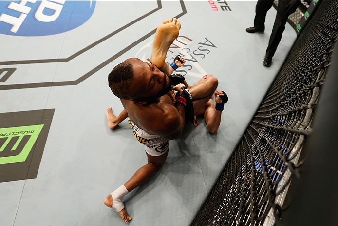LAS VEGAS, NV - SEPTEMBER 27: (Bottom) Brian Ebersole performs an illegal upkick on John Howard in their welterweight fight during the UFC 178 event inside the MGM Grand Garden Arena on September 27, 2014 in Las Vegas, Nevada. (Photo by Josh Hedges/Zuff