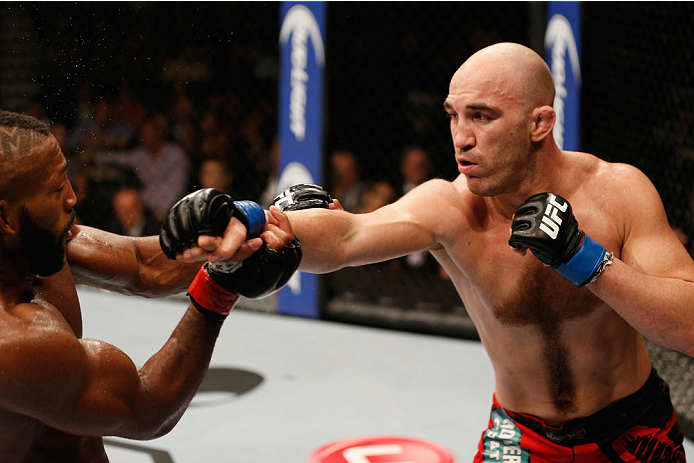 LAS VEGAS, NV - SEPTEMBER 27: (R-L) Brian Ebersole punches John Howard in their welterweight fight during the UFC 178 event inside the MGM Grand Garden Arena on September 27, 2014 in Las Vegas, Nevada. (Photo by Josh Hedges/Zuffa LLC/Zuffa LLC via Getty
