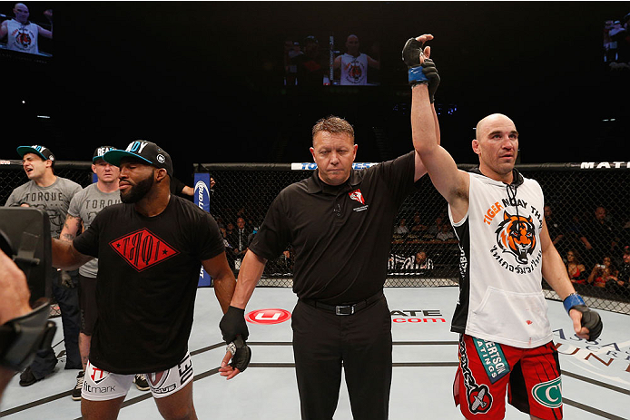 LAS VEGAS, NV - SEPTEMBER 27: (R-L) Brian Ebersole celebrates his split decision win over John Howard after their welterweight fight during the UFC 178 event inside the MGM Grand Garden Arena on September 27, 2014 in Las Vegas, Nevada. (Photo by Josh He