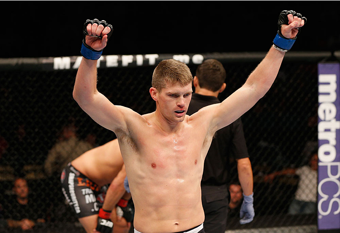LAS VEGAS, NV - SEPTEMBER 27: Josh Thompson raises his hands after finishing the third round against Patrick Cote in their welterweight fight during the UFC 178 event inside the MGM Grand Garden Arena on September 27, 2014 in Las Vegas, Nevada. (Photo b