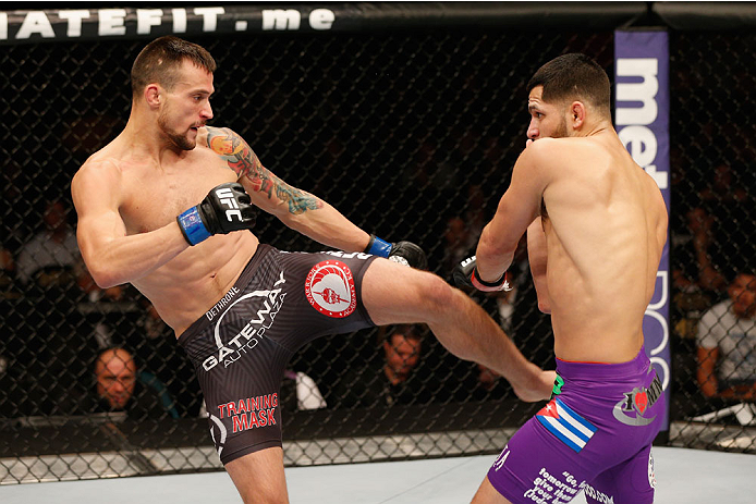 LAS VEGAS, NV - SEPTEMBER 27: (L-R) James Krause kicks Jorge Masvidal in their lightweight fight during the UFC 178 event inside the MGM Grand Garden Arena on September 27, 2014 in Las Vegas, Nevada. (Photo by Josh Hedges/Zuffa LLC/Zuffa LLC via Getty I