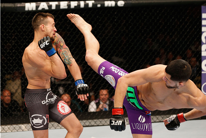 LAS VEGAS, NV - SEPTEMBER 27: (R-L) Jorge Masvidal kicks James Krause in their lightweight fight during the UFC 178 event inside the MGM Grand Garden Arena on September 27, 2014 in Las Vegas, Nevada. (Photo by Josh Hedges/Zuffa LLC/Zuffa LLC via Getty I