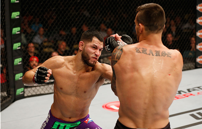 LAS VEGAS, NV - SEPTEMBER 27: (L-R) Jorge Masvidal punches James Krause in their lightweight fight during the UFC 178 event inside the MGM Grand Garden Arena on September 27, 2014 in Las Vegas, Nevada. (Photo by Josh Hedges/Zuffa LLC/Zuffa LLC via Getty