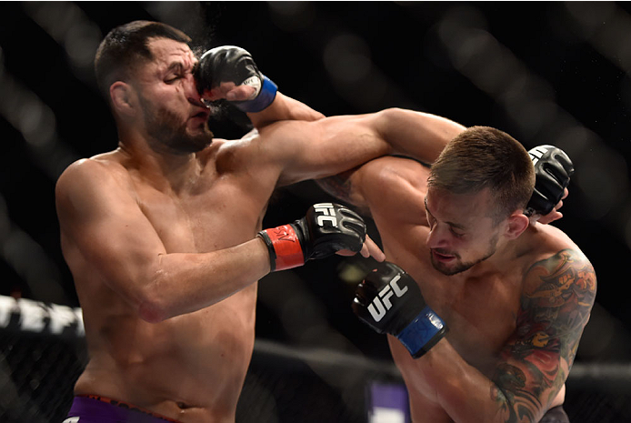 LAS VEGAS, NV - SEPTEMBER 27: (R-L) James Krause punches Jorge Masvidal in their lightweight fight during the UFC 178 event inside the MGM Grand Garden Arena on September 27, 2014 in Las Vegas, Nevada. (Photo by Jeff Bottari/Zuffa LLC/Zuffa LLC via Gett