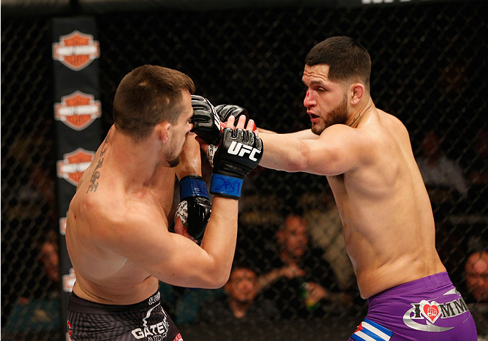 LAS VEGAS, NV - SEPTEMBER 27: (R-L) Jorge Masvidal punches James Krause in their lightweight fight during the UFC 178 event inside the MGM Grand Garden Arena on September 27, 2014 in Las Vegas, Nevada. (Photo by Josh Hedges/Zuffa LLC/Zuffa LLC via Getty