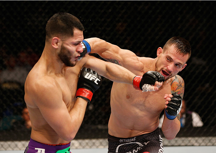 LAS VEGAS, NV - SEPTEMBER 27: (R-L) James Krause and Jorge Masvidal exchange punches in their lightweight fight during the UFC 178 event inside the MGM Grand Garden Arena on September 27, 2014 in Las Vegas, Nevada. (Photo by Josh Hedges/Zuffa LLC/Zuffa