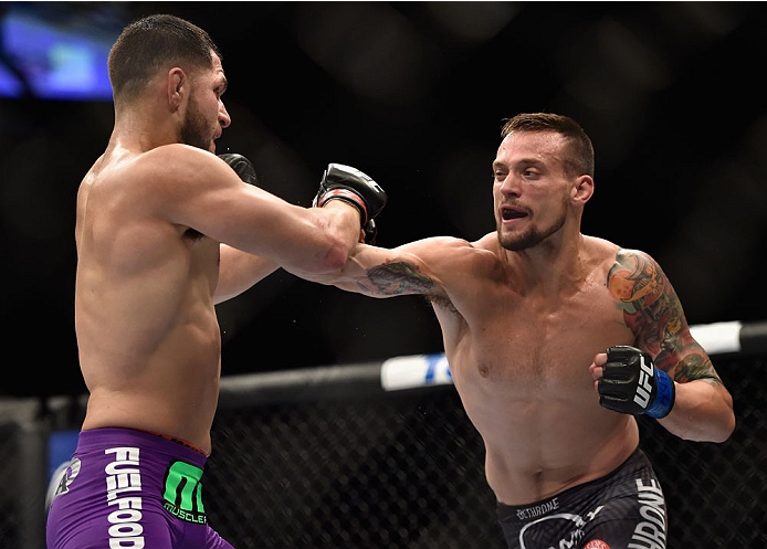 LAS VEGAS, NV - SEPTEMBER 27: (R-L) James Krause punches Jorge Masvidal in their lightweight fight during the UFC 178 event inside the MGM Grand Garden Arena on September 27, 2014 in Las Vegas, Nevada. (Photo by Jeff Bottari/Zuffa LLC/Zuffa LLC via Gett