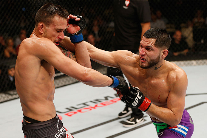 LAS VEGAS, NV - SEPTEMBER 27: (R-L) Jorge Masvidal punches James Krause in their lightweight fight during the UFC 178 event inside the MGM Grand Garden Arena on September 27, 2014 in Las Vegas, Nevada. (Photo by Josh Hedges/Zuffa LLC/Zuffa LLC via Getty