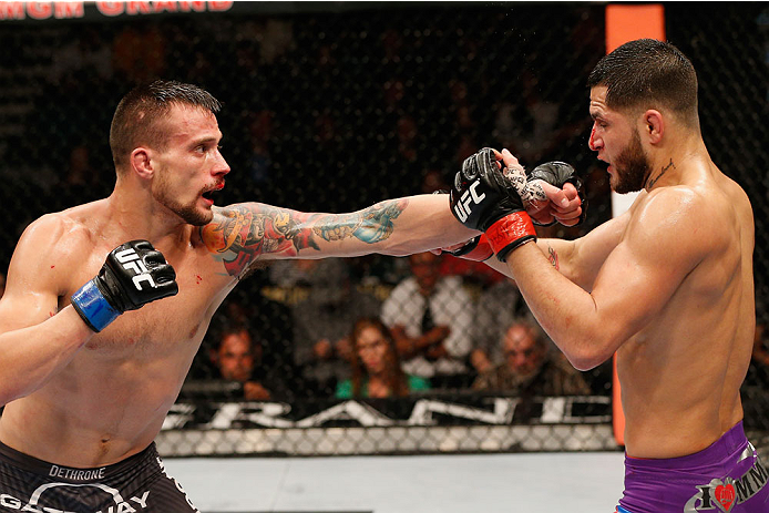 LAS VEGAS, NV - SEPTEMBER 27: (L-R) James Krause punches Jorge Masvidal in their lightweight fight during the UFC 178 event inside the MGM Grand Garden Arena on September 27, 2014 in Las Vegas, Nevada. (Photo by Josh Hedges/Zuffa LLC/Zuffa LLC via Getty