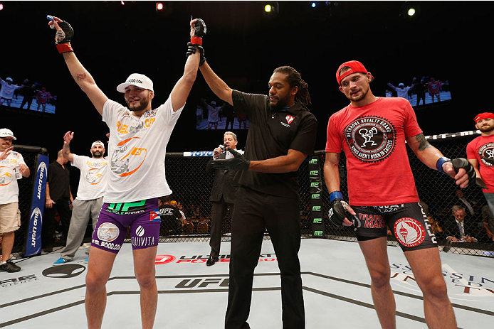 LAS VEGAS, NV - SEPTEMBER 27: (L-R) Jorge Masvidal celebrates his win over James Krause in their lightweight fight during the UFC 178 event inside the MGM Grand Garden Arena on September 27, 2014 in Las Vegas, Nevada. (Photo by Josh Hedges/Zuffa LLC/Zuf