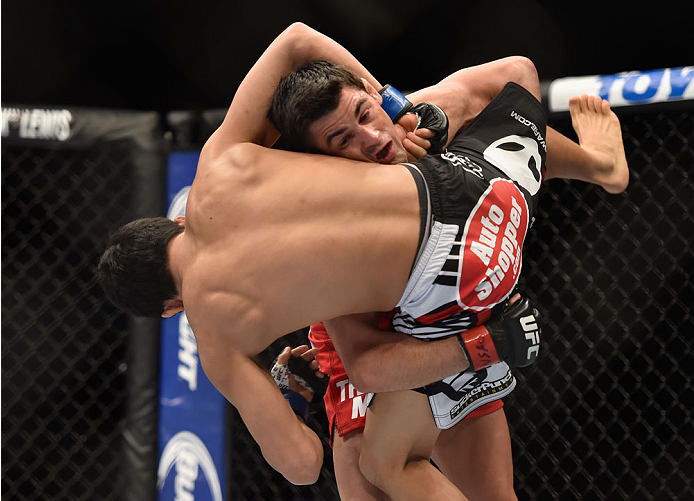LAS VEGAS, NV - SEPTEMBER 27: Dominick Cruz takes down Takeya Mizugaki in their bantamweight fight during the UFC 178 event inside the MGM Grand Garden Arena on September 27, 2014 in Las Vegas, Nevada. (Photo by Jeff Bottari/Zuffa LLC/Zuffa LLC via Gett