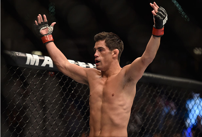 LAS VEGAS, NV - SEPTEMBER 27: Dominick Cruz celebrates after his TKO victory over Takeya Mizugaki in their bantamweight fight during the UFC 178 event inside the MGM Grand Garden Arena on September 27, 2014 in Las Vegas, Nevada. (Photo by Jeff Bottari/Z