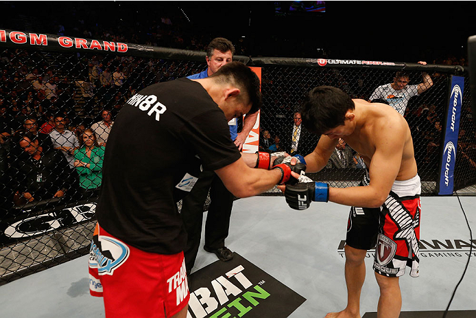 LAS VEGAS, NV - SEPTEMBER 27: (L-R) Dominick Cruz and Takeya Mizugaki show respect towards each other after their bantamweight fight during the UFC 178 event inside the MGM Grand Garden Arena on September 27, 2014 in Las Vegas, Nevada. (Photo by Josh He