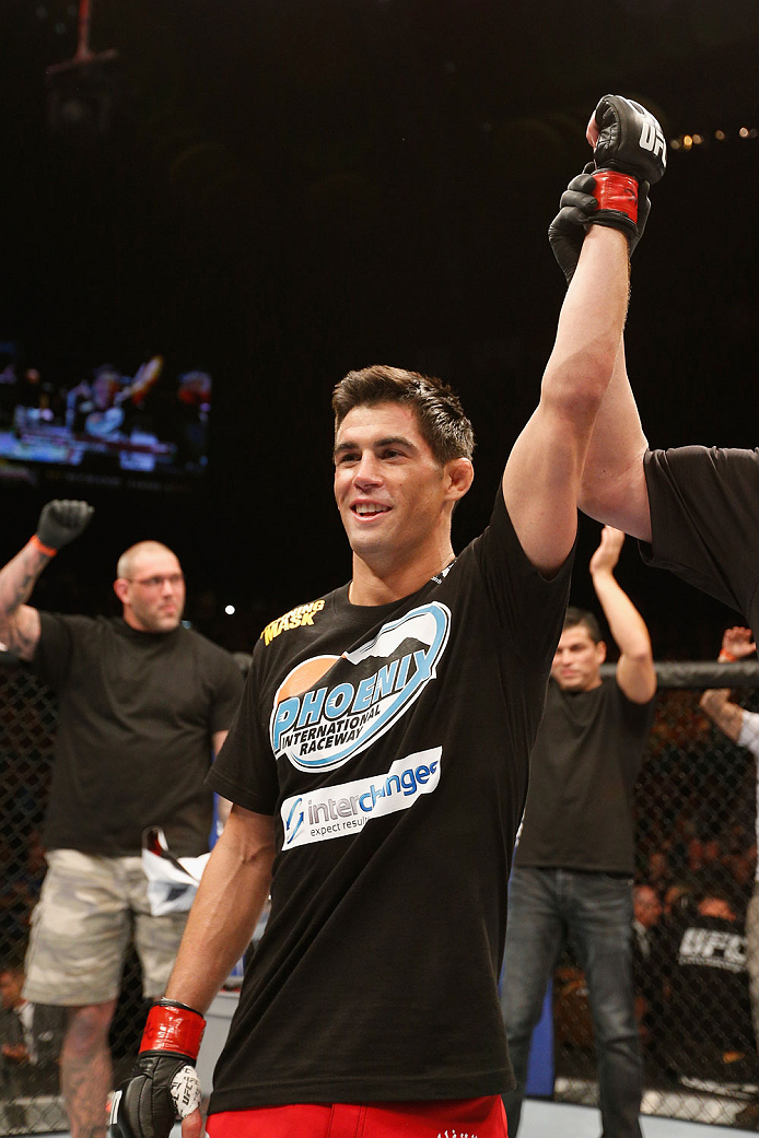 LAS VEGAS, NV - SEPTEMBER 27: Dominick Cruz celebrates after his TKO victory over Takeya Mizugaki in their bantamweight fight during the UFC 178 event inside the MGM Grand Garden Arena on September 27, 2014 in Las Vegas, Nevada. (Photo by Josh Hedges/Zu