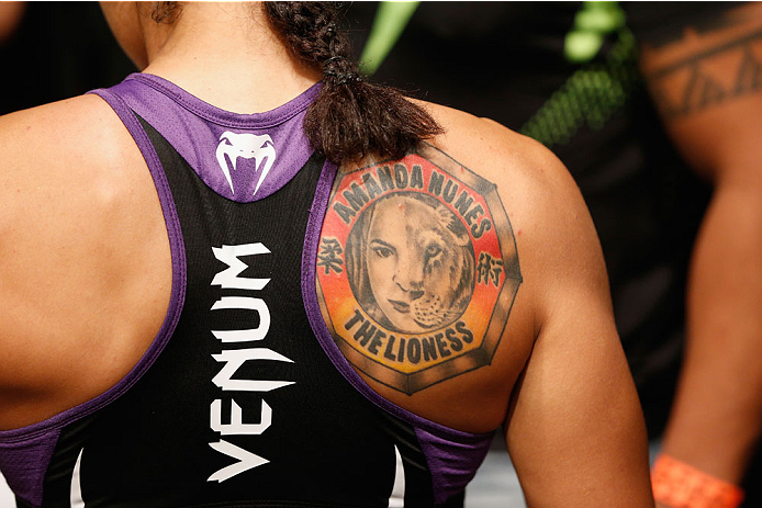 LAS VEGAS, NV - SEPTEMBER 27: Amanda Nunes enters the Octagon for her fight with Cat Zingano in their women's bantamweight fight during the UFC 178 event inside the MGM Grand Garden Arena on September 27, 2014 in Las Vegas, Nevada. (Photo by Josh Hedges