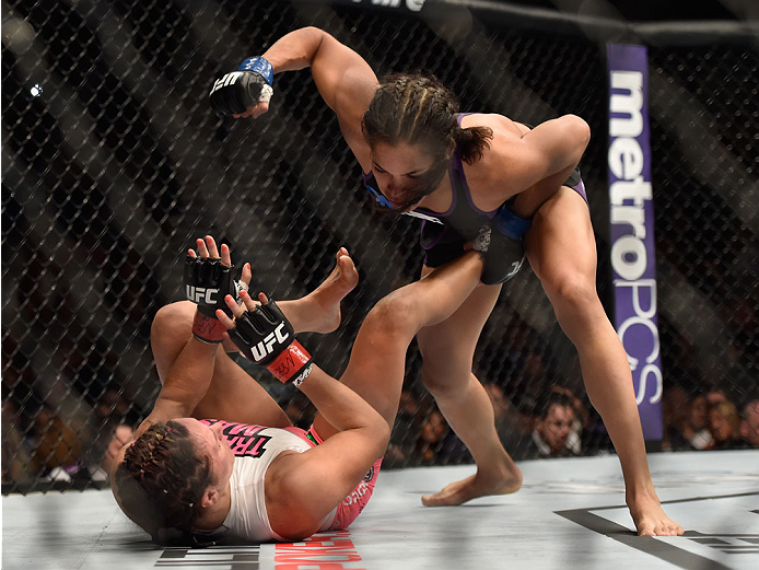 LAS VEGAS, NV - SEPTEMBER 27: (Top) Amanda Nunes punches Cat Zingano in their women's bantamweight fight during the UFC 178 event inside the MGM Grand Garden Arena on September 27, 2014 in Las Vegas, Nevada. (Photo by Jeff Bottari/Zuffa LLC/Zuffa LLC vi
