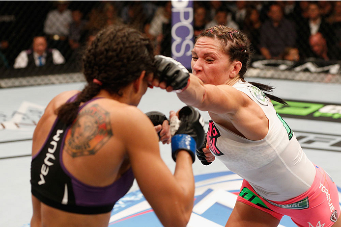 LAS VEGAS, NV - SEPTEMBER 27: (R-L) Cat Zingano punches Amanda Nunes in their women's bantamweight fight during the UFC 178 event inside the MGM Grand Garden Arena on September 27, 2014 in Las Vegas, Nevada. (Photo by Josh Hedges/Zuffa LLC/Zuffa LLC via