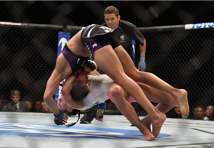 LAS VEGAS, NV - SEPTEMBER 27: Cat Zingano takes down Amanda Nunes in their women's bantamweight fight during the UFC 178 event inside the MGM Grand Garden Arena on September 27, 2014 in Las Vegas, Nevada. (Photo by Jeff Bottari/Zuffa LLC/Zuffa LLC via G