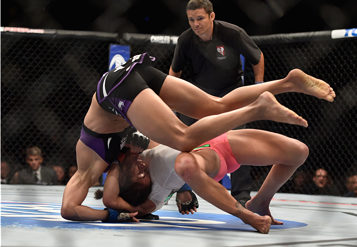 LAS VEGAS, NV - SEPTEMBER 27: Cat Zingano takes down Amanda Nunes in their women's bantamweight fight during the UFC 178 event inside the MGM Grand Garden Arena on September 27, 2014 in Las Vegas, Nevada. (Photo by Jeff Bottari/Zuffa LLC/Zuffa LLC via G