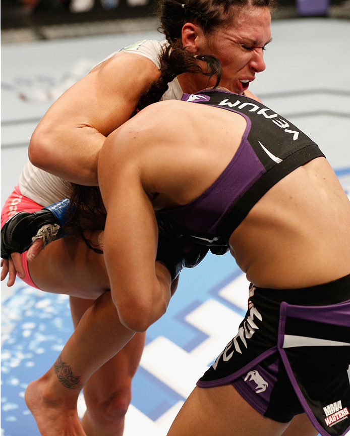LAS VEGAS, NV - SEPTEMBER 27: (L-R) Cat Zingano knees Amanzda Nunes in their women's bantamweight fight during the UFC 178 event inside the MGM Grand Garden Arena on September 27, 2014 in Las Vegas, Nevada. (Photo by Josh Hedges/Zuffa LLC/Zuffa LLC via