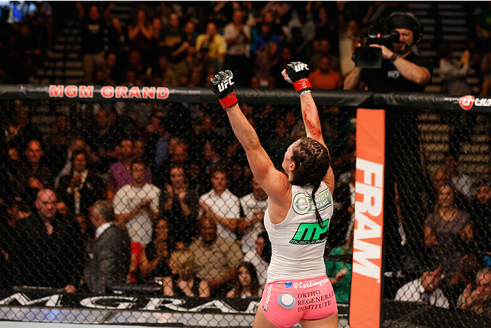 LAS VEGAS, NV - SEPTEMBER 27: Cat Zingano celebrates after her TKO win over Amanda Nunes in their women's bantamweight fight during the UFC 178 event inside the MGM Grand Garden Arena on September 27, 2014 in Las Vegas, Nevada. (Photo by Josh Hedges/Zuf