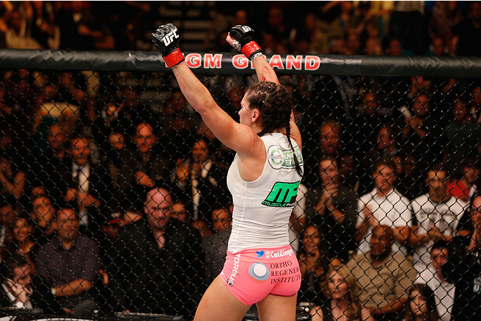 LAS VEGAS, NV - SEPTEMBER 27: Cat Zingano celebrates after her TKO win over Amanda Nunes in their women's bantamweight fight during the UFC 178 event inside the MGM Grand Garden Arena on September 27, 2014 in Las Vegas, Nevada. (Photo by Josh Hedges/Zuf