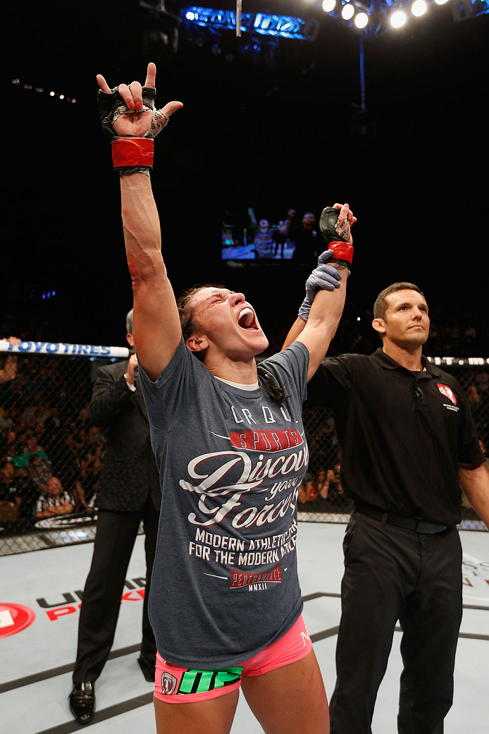 LAS VEGAS, NV - SEPTEMBER 27: Cat Zingano celebrates after her TKO win over Amanda Nunes in their women's bantamweight fight during the UFC 178 event inside the MGM Grand Garden Arena on September 27, 2014 in Las Vegas, Nevada. (Photo by Josh Hedges/Zuf