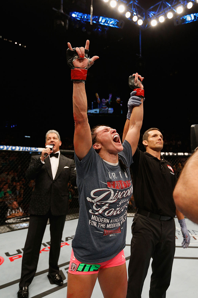 LAS VEGAS, NV - SEPTEMBER 27: Cat Zingano celebrates after her TKO win over Amanda Nunes in their women's bantamweight fight during the UFC 178 event inside the MGM Grand Garden Arena on September 27, 2014 in Las Vegas, Nevada. (Photo by Josh Hedges/Zuf